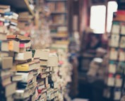 assorted books in shallow focus photography