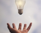person catching light bulb